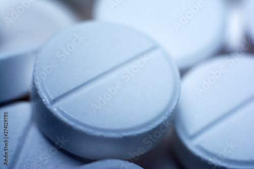 Close-up of white tablets. Macro white pills. Can use as background in medicene.