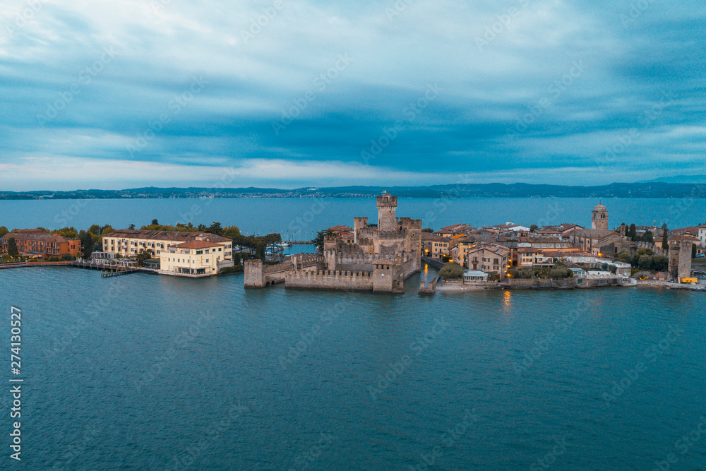 Aerial shot of Sirmione peninsula and the castle in the middle of Lake Garda