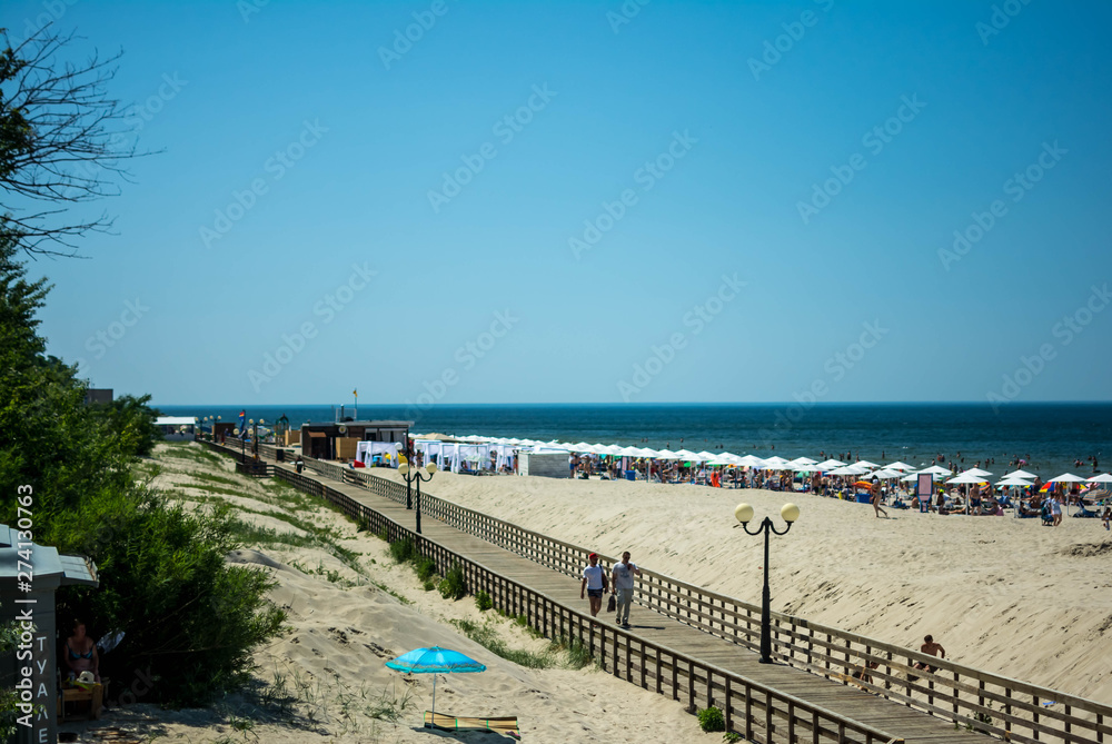 .wooden promenade on the sea beach