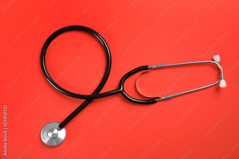 Stethoscope on color background, top view. Medical tool Stethoscope on color background, top view. Medical tool