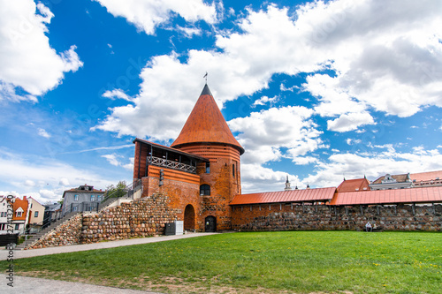 Historical gothic Kaunas Castle from medieval times in Kaunas, Lithuania. Wide angle panoramic view on cloudy sky background