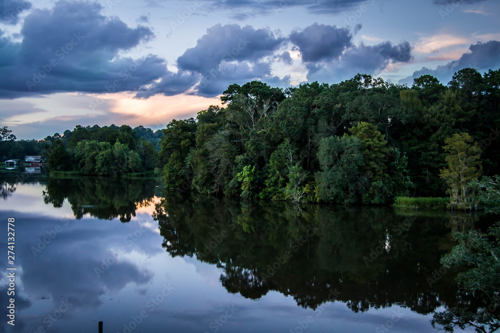 Fototapeta premium Purple sunset over the river
