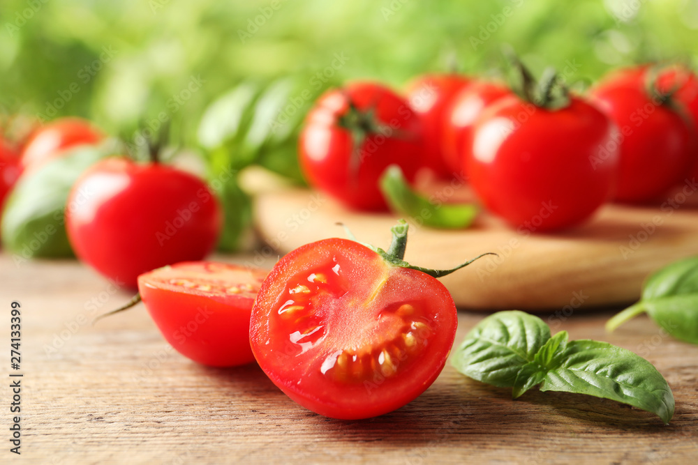 Fresh organic cherry tomatoes on wooden table Fresh organic cherry tomatoes on wooden table