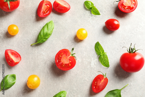 Flat lay composition with cherry tomatoes on light background
