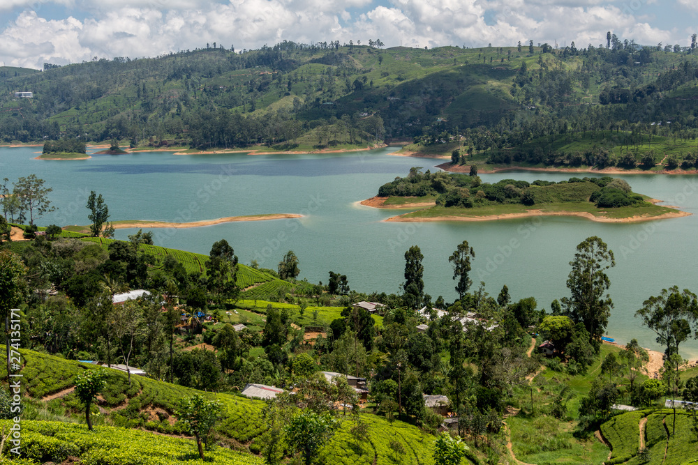 Sri Lanka Hill country landscape. Tea plantations and lake scenery. Nature scenery on bright, sunny day.