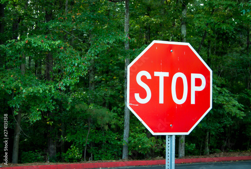 Red stop sign in green area