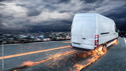 Foto Super fast delivery of package service with van with wheels on fire