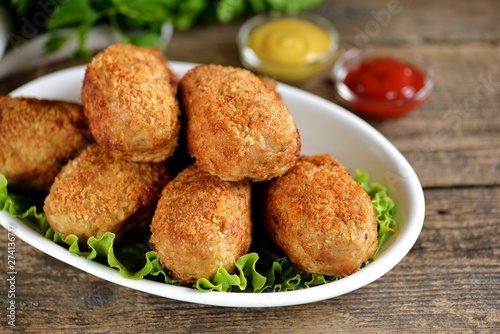 Fried meat balls with boiled quail egg inside.