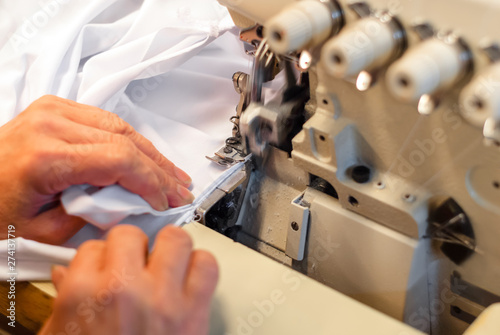 industrial overlock sewing machine in work