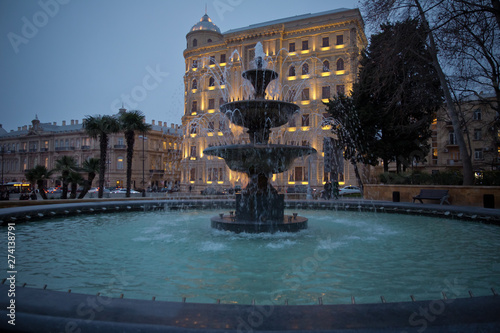 Baku Azerbaijan . night vision of a round park Fountains square . The fountain in the city center.