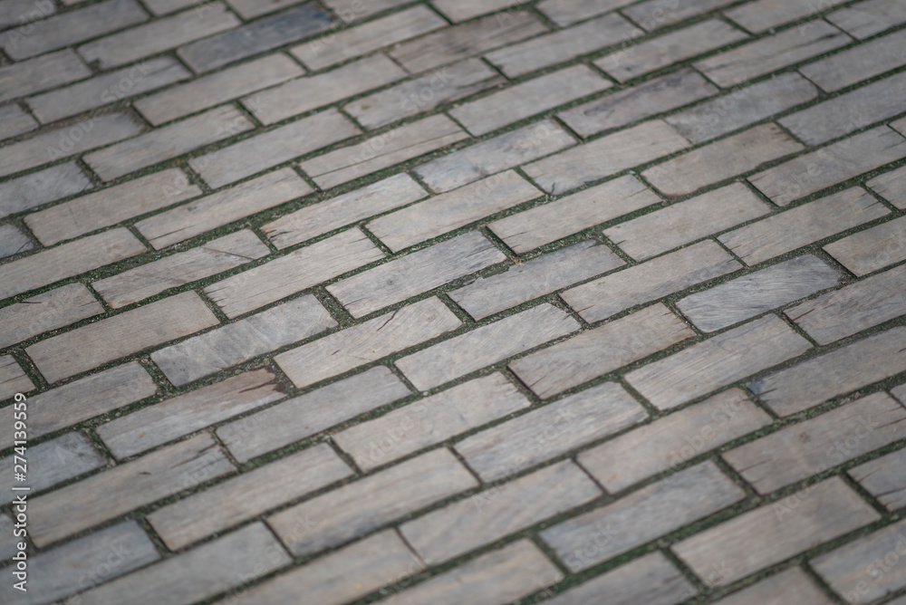Wooden pavement. Wooden road, old road, old wooden bricks on the paving