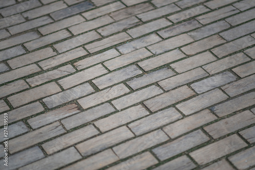 Wooden pavement. Wooden road, old road, old wooden bricks on the paving