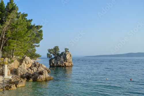 Adriatic Sea beach in the resort town of Brela, Croatia. Islet on Punta Rata beach in the resort town of Brela, Makarska riviera of Dalmatia, Croatia