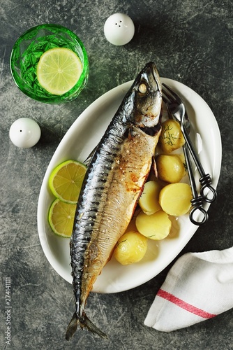 Delicious baked mackerel with dill, onion and lime. Healthy food.