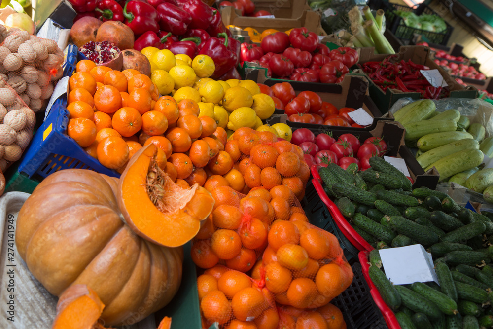 pumpkin and apelsins and other vegetables in sale in outdoor farmer market