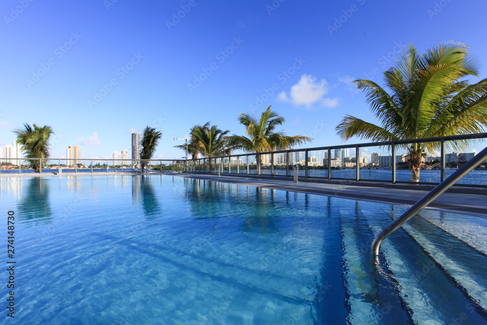Pool with steps overlooking the water in Miami