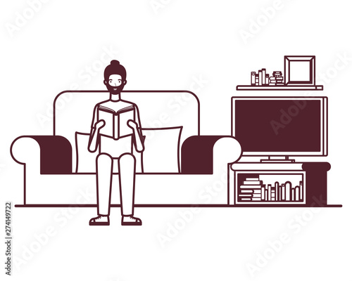 silhouette of man with book in hands in living room