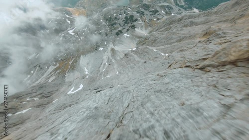 Through The Clouds Mountain Dive in Falzarego Dolomite. Drone FPV Freestyle Shot.