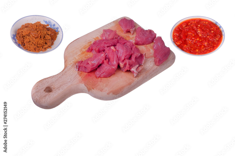 Appetizing red fresh veal, sliced into raw thin beef, chili and coconut fried or Kerisik isolated on white background Appetizing red fresh veal, sliced into raw thin beef, chili and coconut fried or Kerisik isolated on white background
