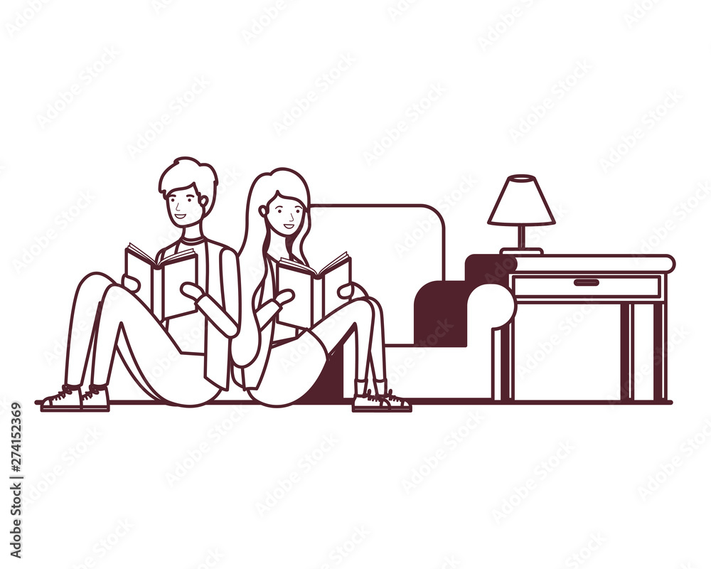 Fototapeta premium silhouette of couple with book in hands in living room