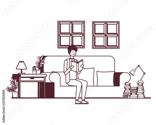 silhouette of man with book in hands in living room