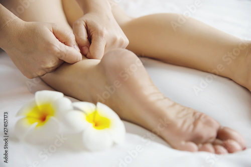 Woman receiving foot massage service from masseuse close up at hand and foot - relax in foot massage therapy service concept © pairhandmade