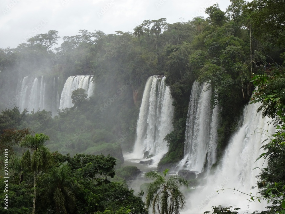 Fototapeta premium waterfall, water, river, nature, landscape, falls, stream, cascade, forest, fall, green, rock, tree, park, waterfalls, flowing, wet, flow, stone, beautiful, travel, environment, lake, natural, iguazu,