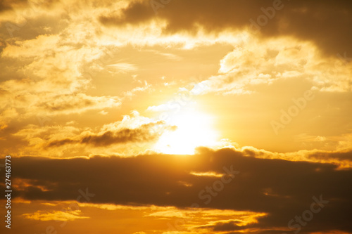 Evening weather, Golden sky and cloud with Light sunshine, Dark shadow meadow in the field.