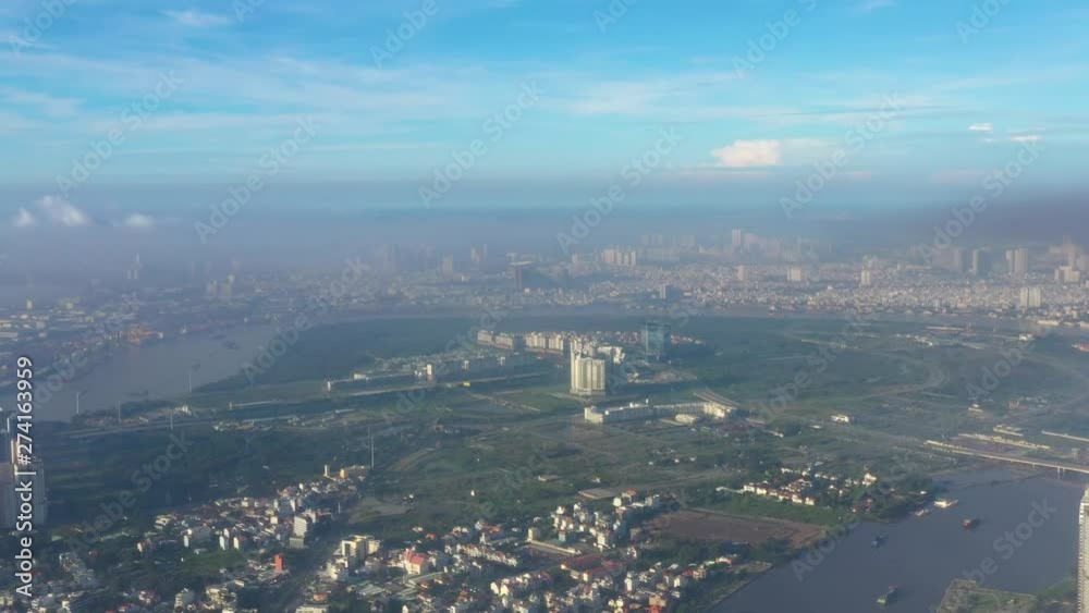 Aerial view of Downtown district of Ho Chi Minh City, aka Saigon, on sunset , including architectural landmark during daytime, South Vietnam