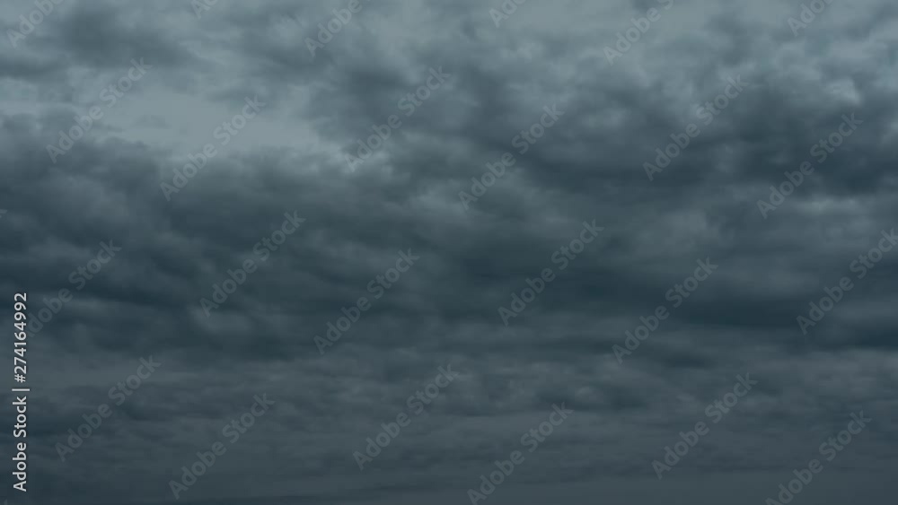 Timelapse of dramatic storm clouds moving towards the camera. Dark and blue about to break out in thunder, rain and storm. Timelapse of dramatic storm clouds moving towards the camera. Dark and blue about to break out in thunder, rain and storm.