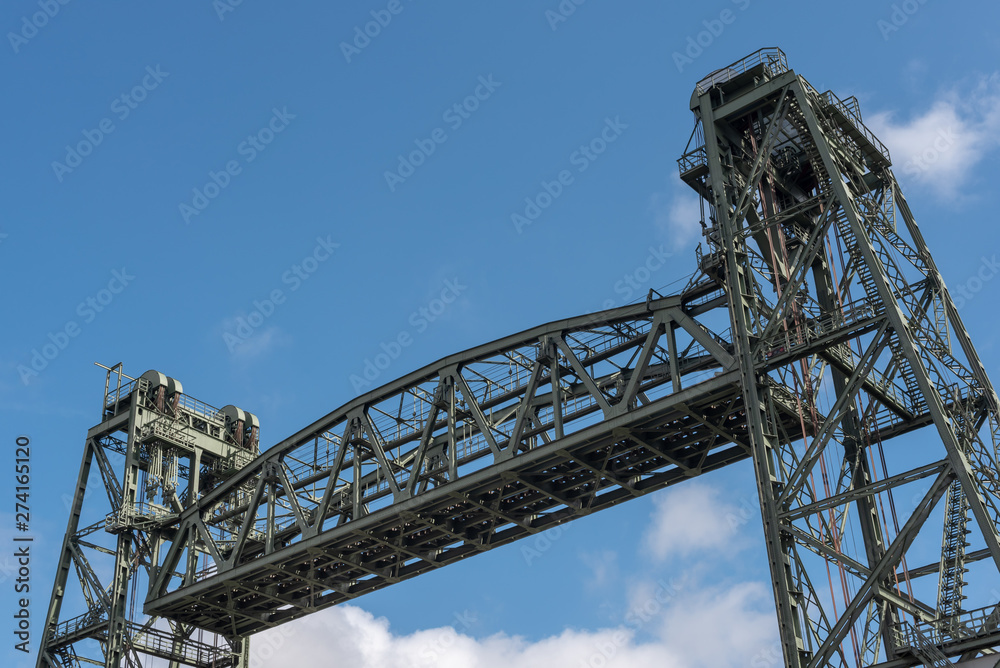 Top of Monumental Koningshaven Railway Bridge - de Hef - against blue sky in Rotterdam, Netherlands Top of Monumental Koningshaven Railway Bridge - de Hef - against blue sky in Rotterdam, Netherlands