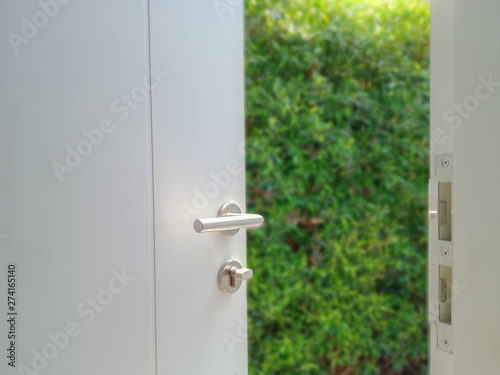 Open door opening the door with garden view. nature background
