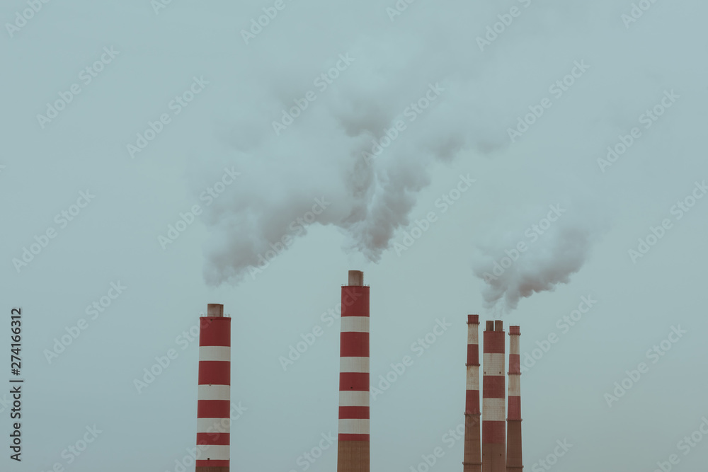 Aerial view of Industrial smokestacks of a thermal power plant Aerial view of Industrial smokestacks of a thermal power plant