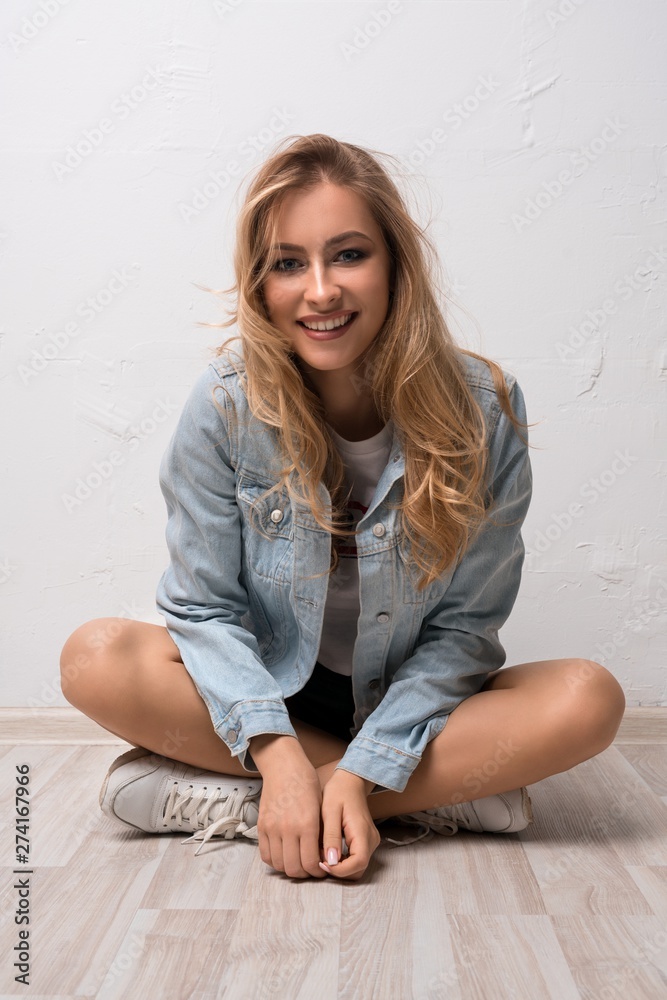 Pretty blonde in jeans jacket view Pretty blonde in jeans jacket view