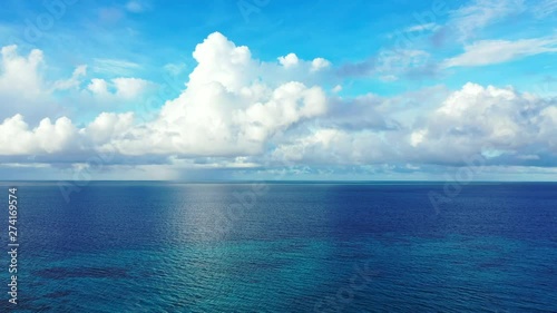 Wallpaper Mural philippines aerial footage of beautiful crystal clean ocean water with white big clouds at the background Torontodigital.ca