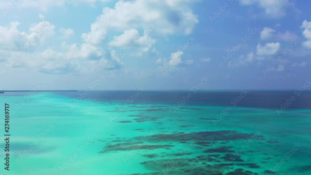 maldives aerial shot moving from top to bottom of turquise clean water maldives aerial shot moving from top to bottom of turquise clean water