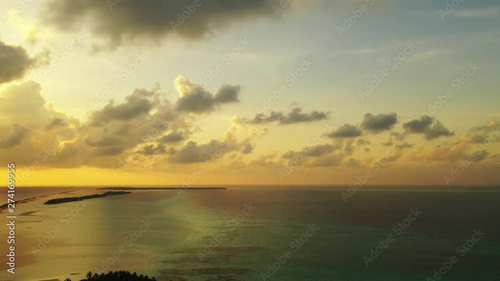 tropics big white fluffy clouds above ocean clean water drone aerial shot philippines