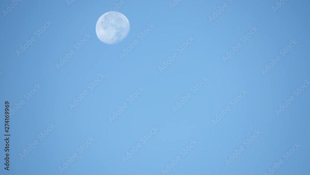 Full moon In the morning moving fast In a bright sky and cloud moving fast. Full moon In the morning moving fast In a bright sky and cloud moving fast.