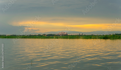 Bueng Boraphet Lake at sunset in Nakhorn Sawan Province, Thailand photo