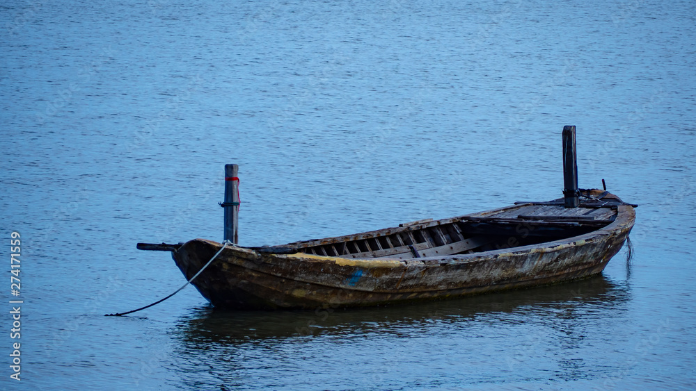 Wooden boat parked in the sea, Shallow water area. Wooden boat parked in the sea, Shallow water area.