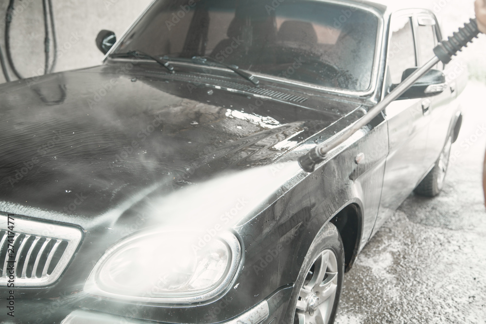 Car washing. The washing process on a self service car wash Car washing. The washing process on a self service car wash
