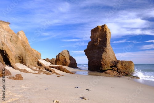 Принти на полотні Crashing waves and rising water levels cause massive erosion on a New England be