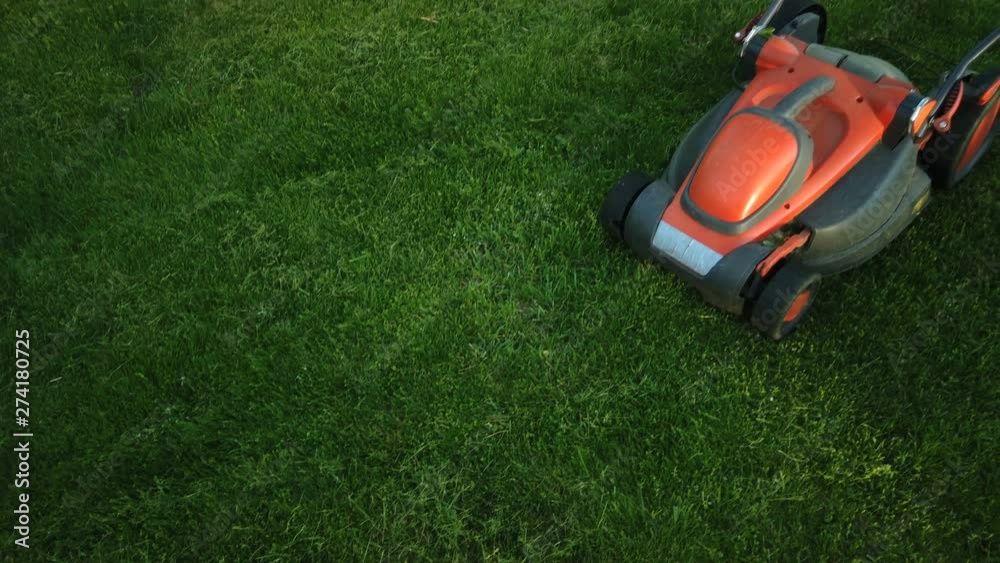 Lawn mower cutting the grass Lawn mower cutting the grass