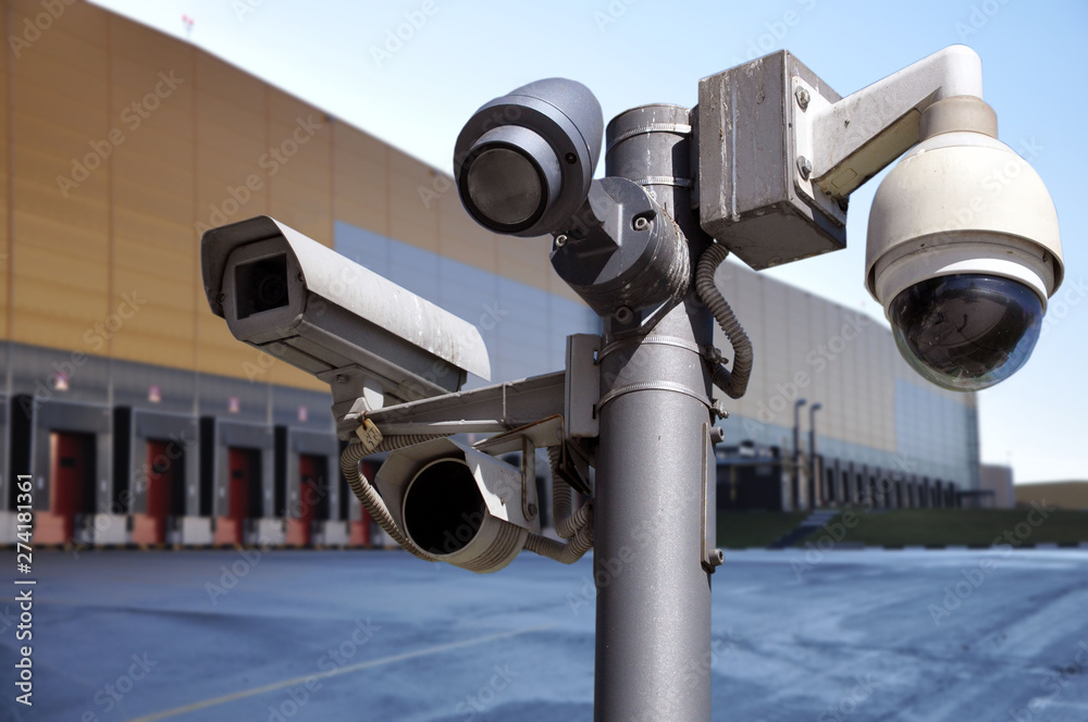 closed circuit camera Multi-angle CCTV system on the background of the warehouse buildings.