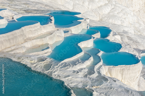 Fototapeta Naklejka Na Ścianę i Meble -  Natural travertine pools and terraces in Pamukkale. Cotton castle in southwestern Turkey