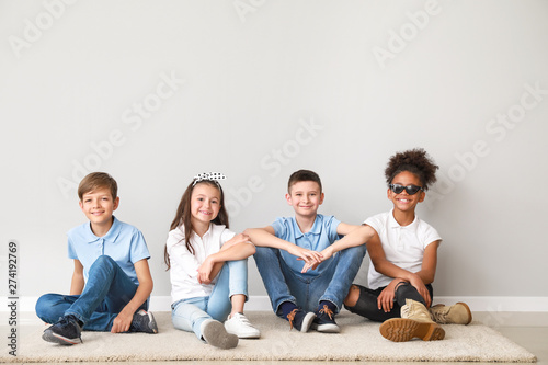Stylish children in jeans s...