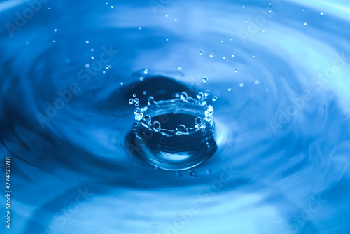 Drop of water. Blue water drop. Water splash close-up.