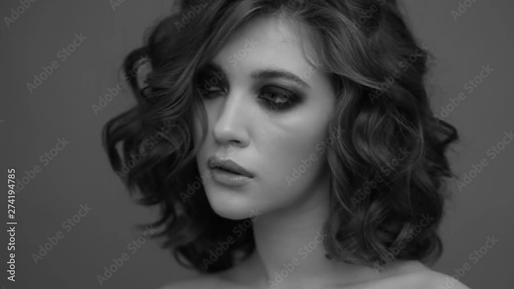 Brunette posing on camera. Black and white video. Emotions girls with a slight flirtation. Brunette posing on camera. Black and white video. Emotions girls with a slight flirtation.