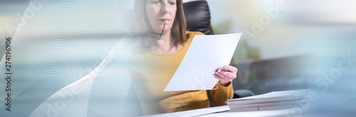 Businesswoman checking document, light effect. panoramic banner