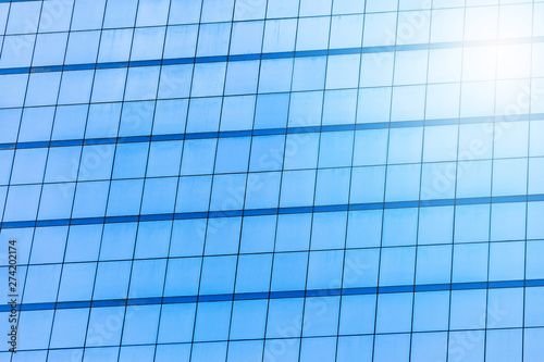 Blue glass windows of office building